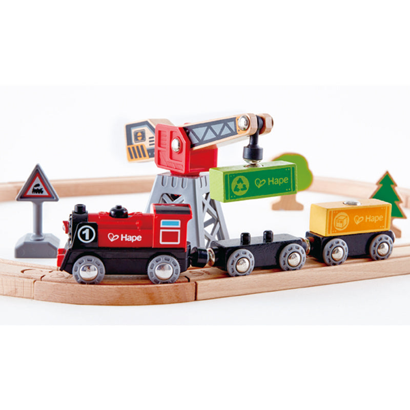  Hape Crane and Cargo Train Set  Wooden Railway Toy Set with  Magnetic Crane, Button Operated Loader and Adjustable Rail Signal  Multicolor, 19.69 Large x 19.69 W x 15.16 H ,count